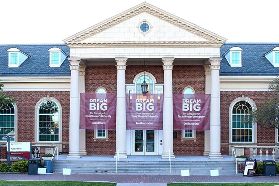exterior front photo of Hubbard Hall with three Dream Big maroon banners draped from top to bottom
