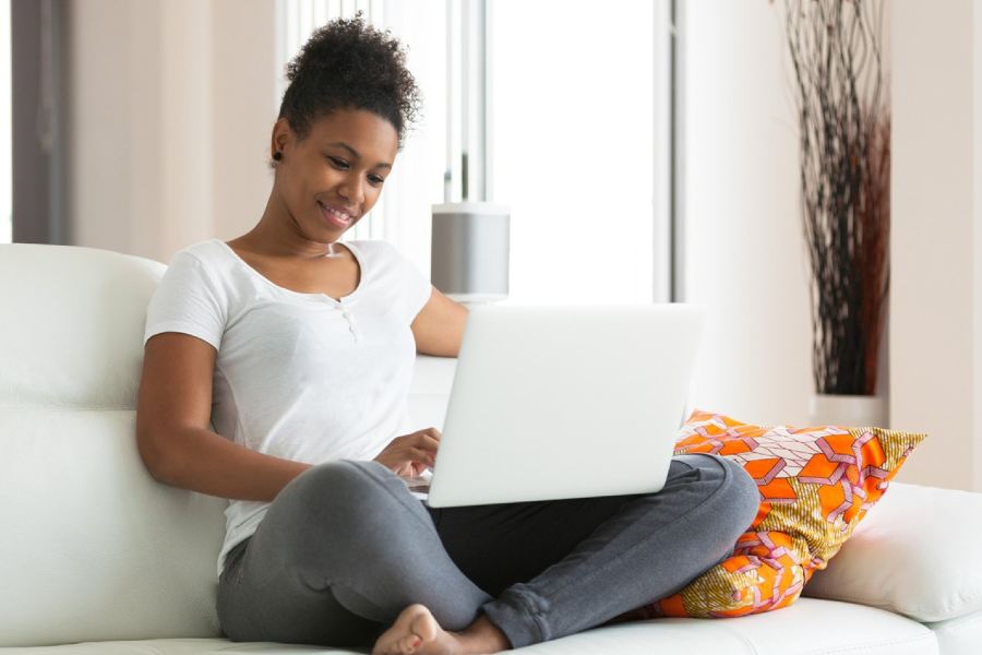 A health studies student works on a laptop computer