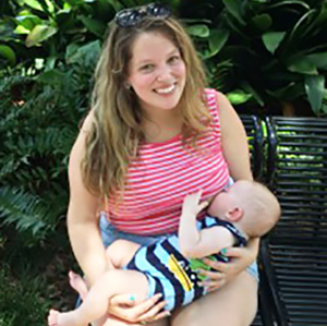 Diana &Aacute;lvarez-Hughes holding a baby